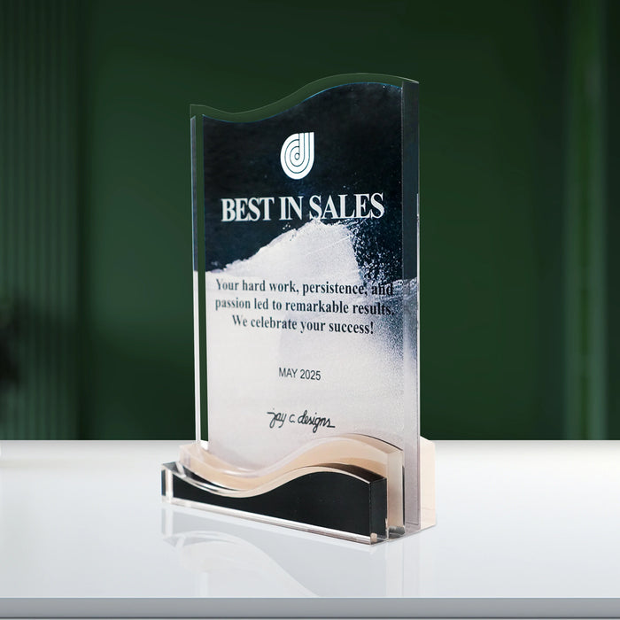 Angled view of a wave-shaped acrylic corporate plaque, ideal for celebrating top performers and business achievements