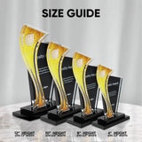 Four sizes available for acrylic trophy-style award plaques with black bases are arranged in a size lineup on a light marble surface against a soft gray backdrop. The image includes the text 'SIZE GUIDE' at the top and height/width measurements at the bottom for each size: 12 inches, 10 inches, 8 inches, and 6 inches.