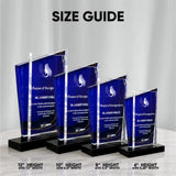 Four clear acrylic award plaques with deep blue gradient panels and black bases, shown in different heights under a 'SIZE GUIDE' heading. Text at the bottom lists the heights and widths for each size: 6 inch 8 inches 10