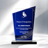 Front view of 8025. A custom acrylic plaque of recognition with a blue and clear geometric design, featuring a white silhouette logo and engraved text, mounted on a black base.