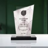 Leadership award with marble design and engraved text on a green background